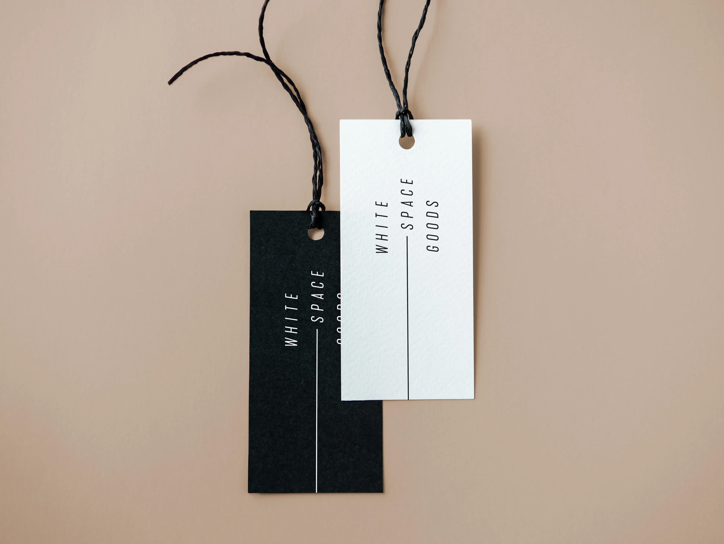 Whitespace Goods clothing tag for Ottawa-based handmade knitware and decor by graphic designer idApostle